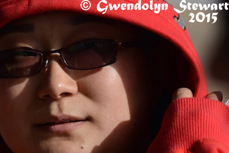 Woman in Red, Kumtag Desert, Xinjiang, China, Photographed by Gwendolyn Stewart, c. 2015; All Rights Reserved